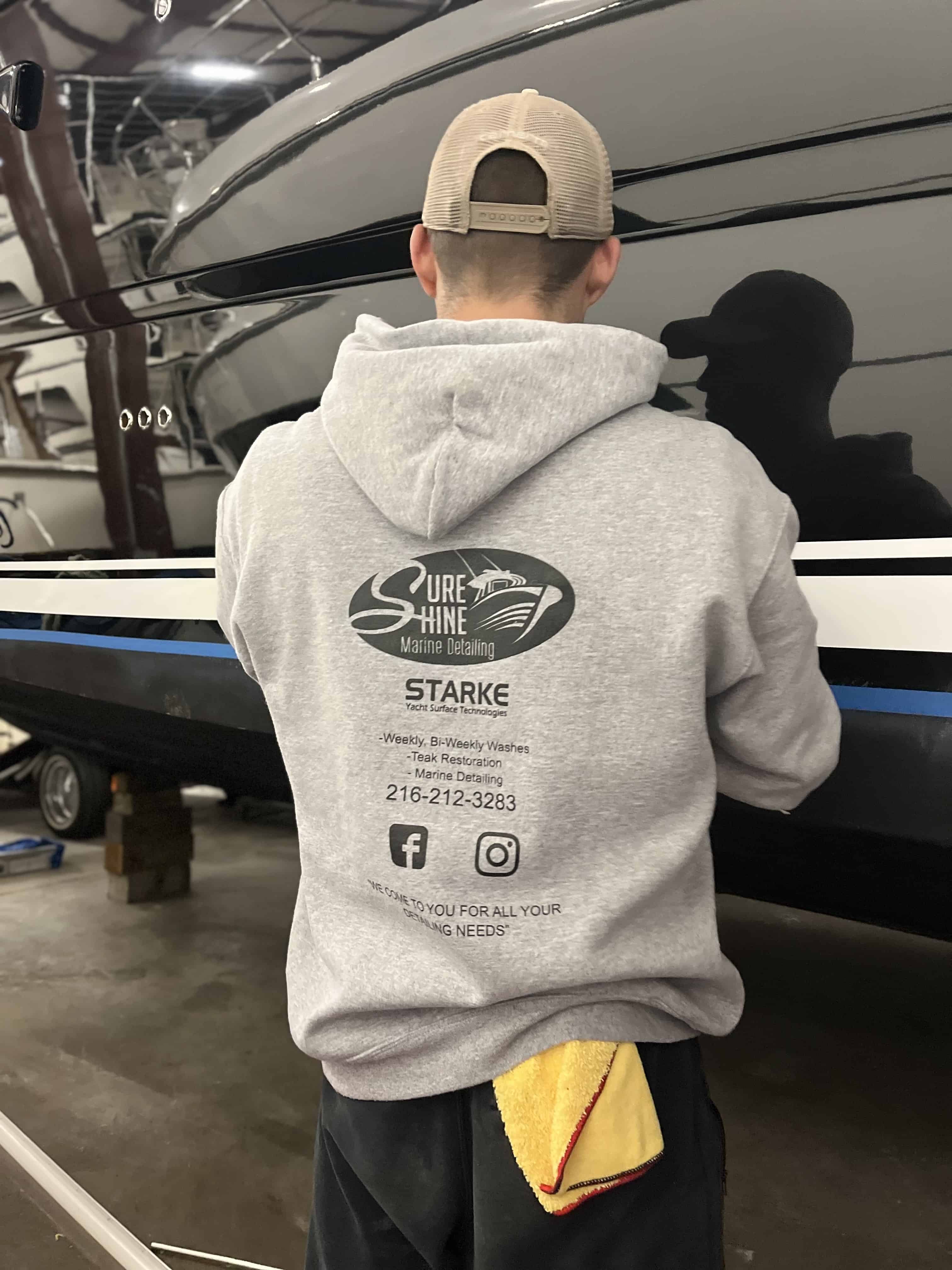 Andrew buffing a hull to a mirror finish