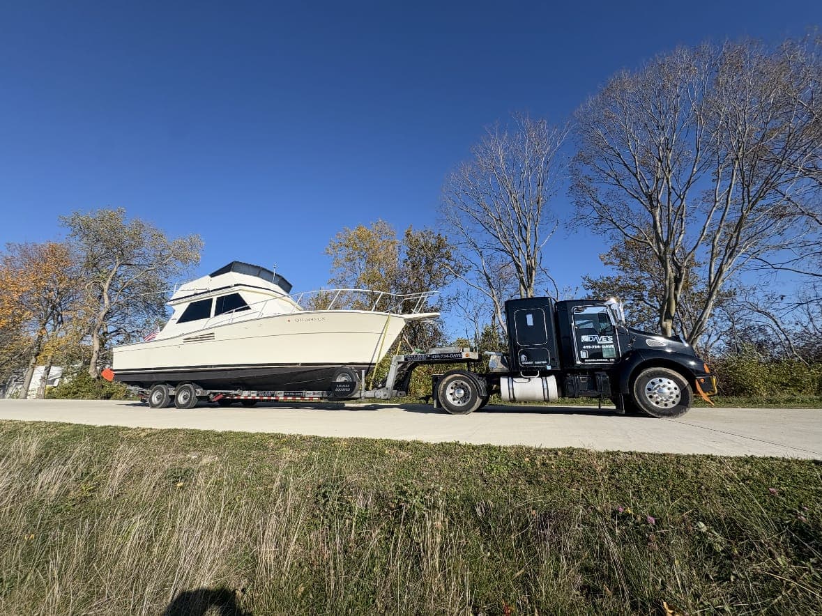 Dave's Marine Transport hauling a flybridge cruiser