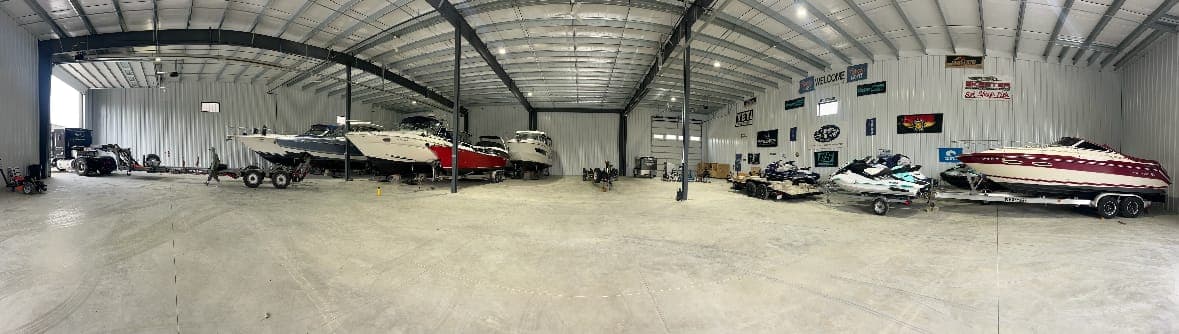 Panorama of the Sure Shine heated storage building, boats and jet skis inside
